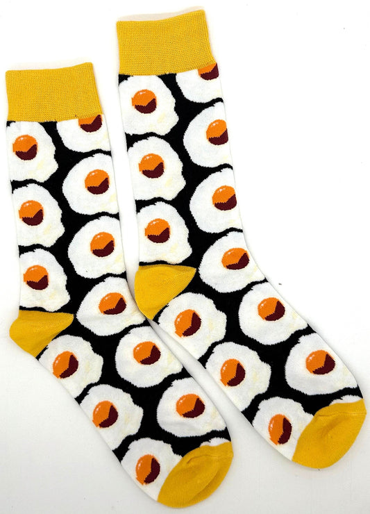 Black mid-calf socks with repeating fried egg pattern and yellow cuff heel toe details