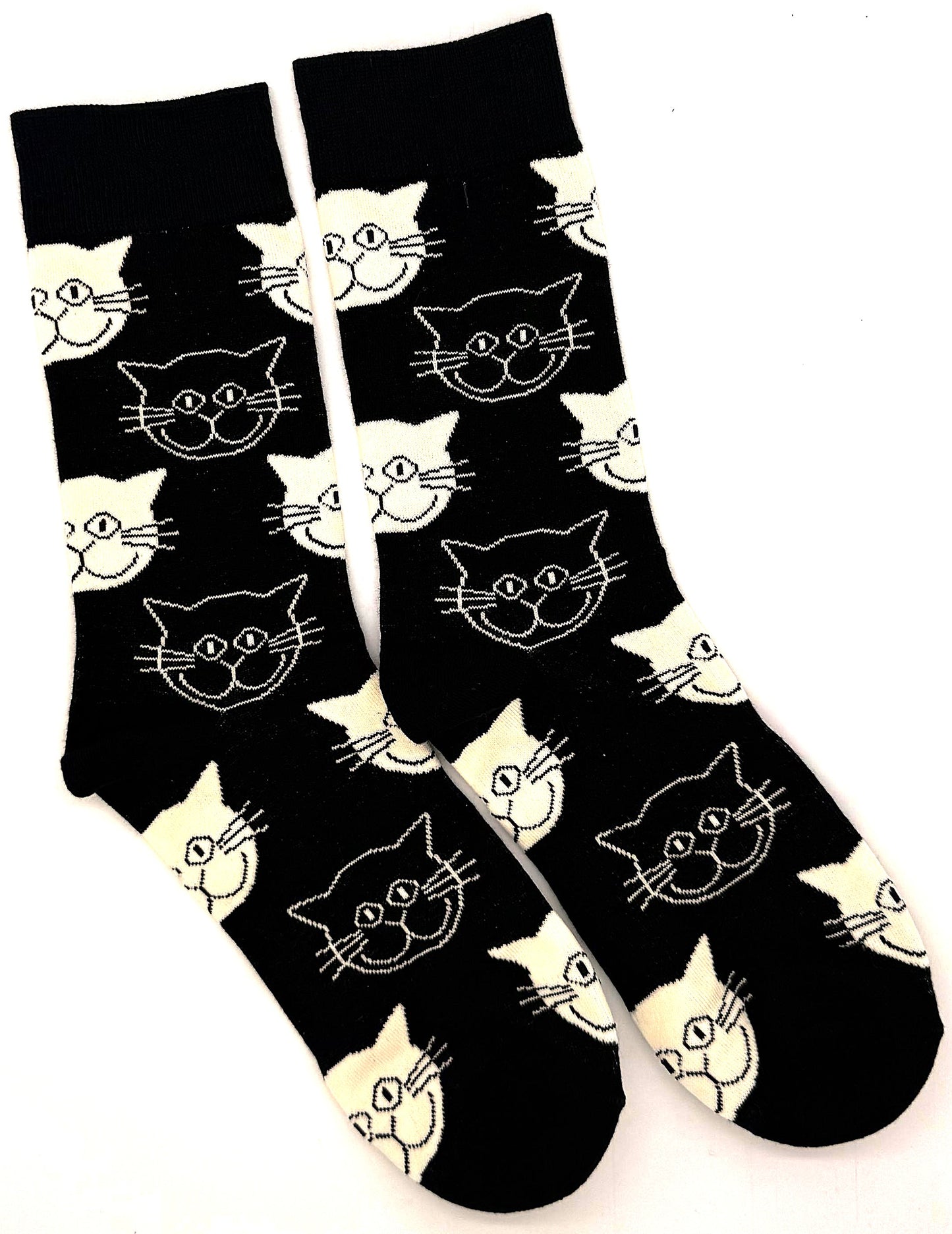 Black socks with white cat face patterns on a white background