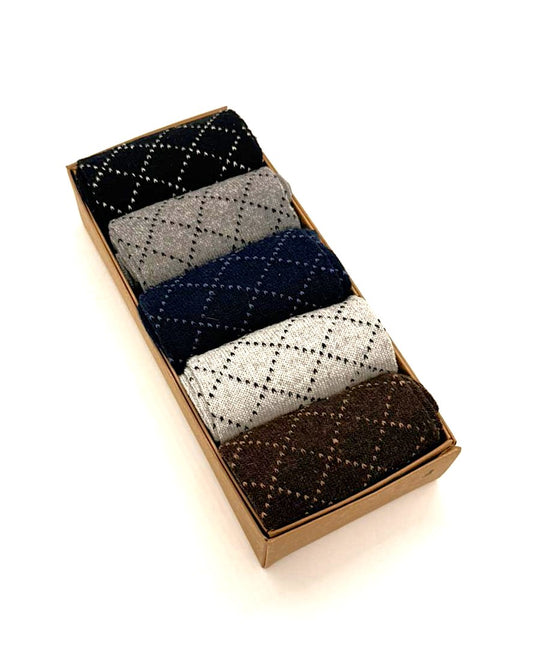 Set of patterned socks in a cardboard box on a white background