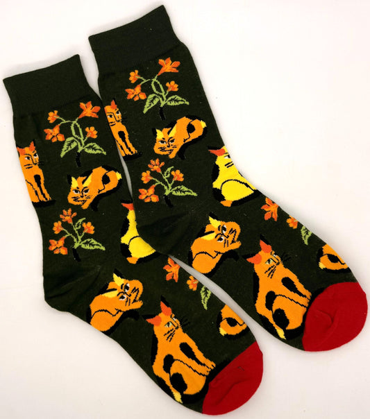 Black socks with orange cat and flower pattern on a white background
